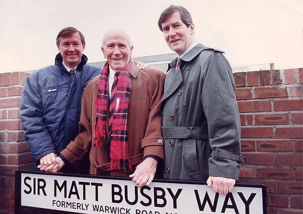 Sir Matt Busby with Alex Ferguson and Martin Edwards standing in Sir Matt Busby Way