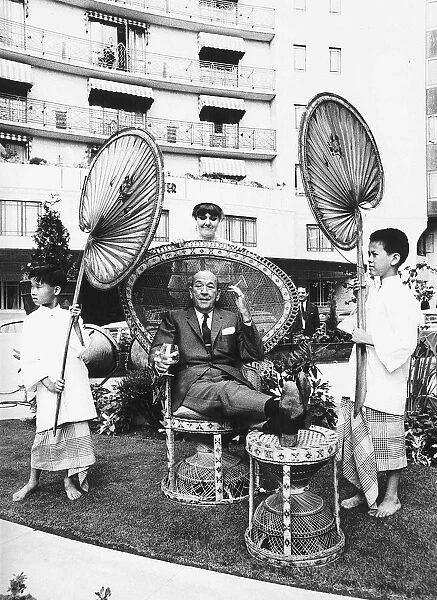 Sir Noel Coward actor relaxing outside Dorchester Hotel dbase MSI