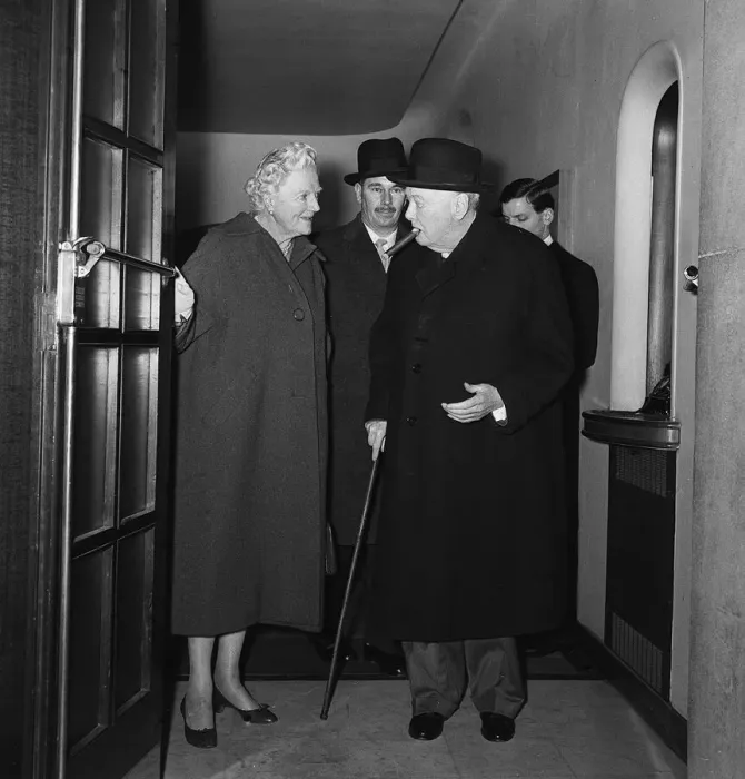 Framed Print : Sir Winston Churchill with his wife Lady Churchill leaving a side entrance of the Savoy