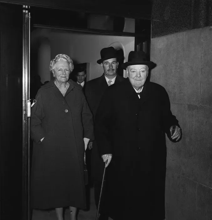 Framed Print : Sir Winston Churchill with his wife Lady Churchill leaving a side entrance of the Savoy