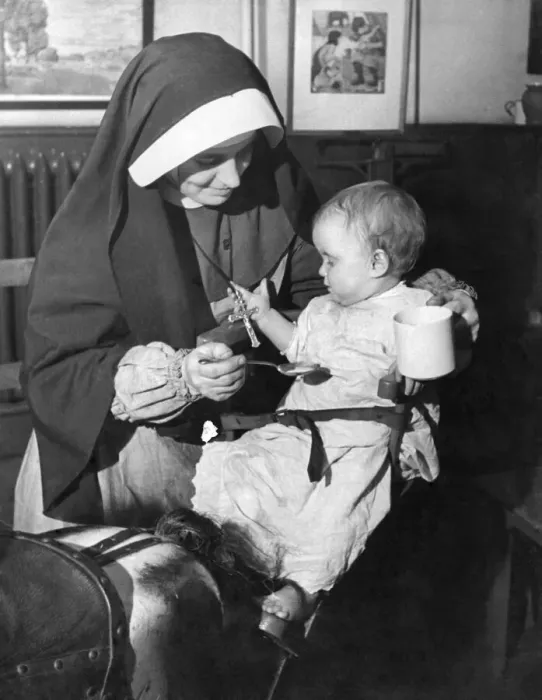 Framed Print : Sister Camillus of St. Anne with Margaret Horton aged 10 months who has just been brought Framed Print : Sister Camillus of St. Anne with Margaret Horton aged 10 months who has just been brought