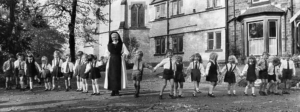 Sister David Power with her pupils at Holly Mount Convent at Tottington, near Bury, Lanes