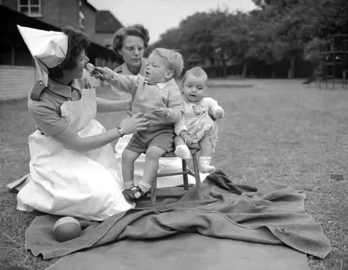 Framed Print : Sister Rose Pedel pictured here holding two small children who had been placed in Stepney Framed Print : Sister Rose Pedel pictured here holding two small children who had been placed in Stepney