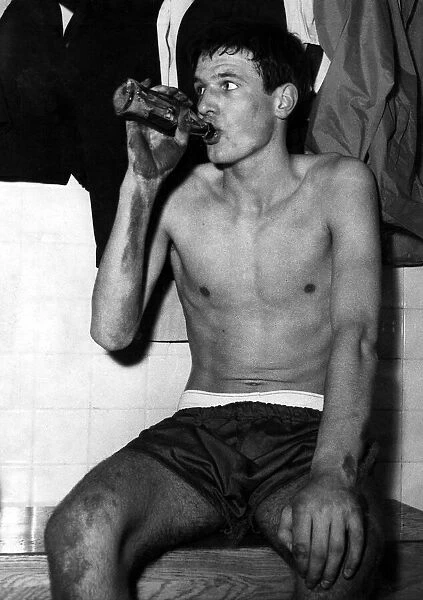 Sixteen year old Cardiff City footballer John Toshack enjoys a celebration drink