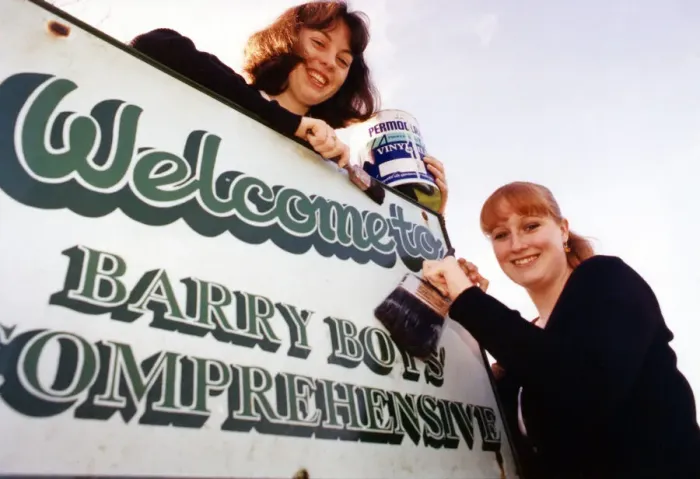 Framed Print : Sixth form pupils Anne-Marie Toms aged 17 and Hannah Wilton aged 18 paint the word Boys Framed Print : Sixth form pupils Anne-Marie Toms aged 17 and Hannah Wilton aged 18 paint the word Boys