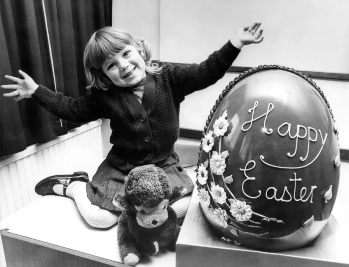 Framed Print : Sizing up the giant Easter egg is three year old Janette Lee, of Cheviot Court, Wallsend