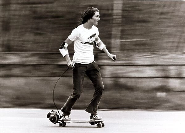 Skateboarding - Tim Lewis, on a motorised skateboard, for a promotional film at