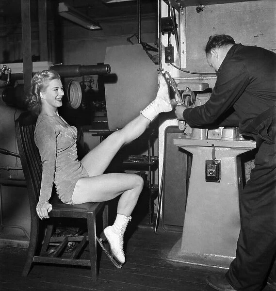 Skater Sheila Hamilton gets her skates put on for her performance in '