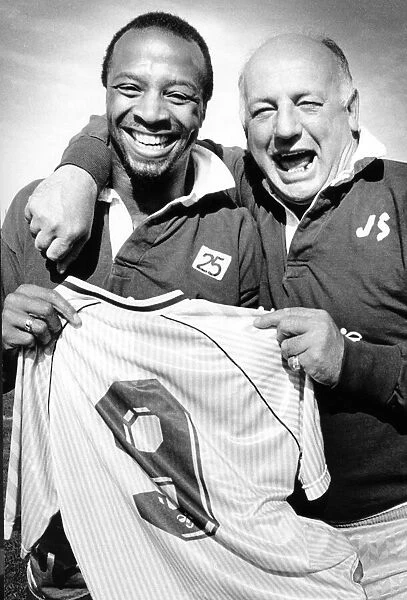 Sky Blues manager John Sillett hands the number 9 shirt to Cyrille Regis for tomorrow