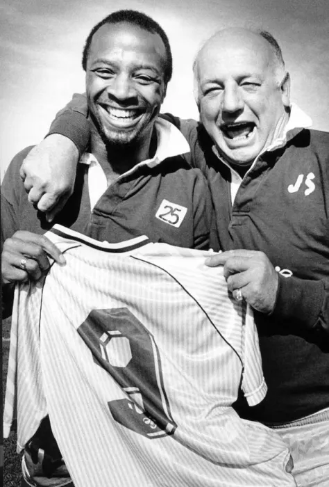 Framed Print : Sky Blues manager John Sillett hands the number 9 shirt to Cyrille Regis for tomorrow Framed Print : Sky Blues manager John Sillett hands the number 9 shirt to Cyrille Regis for tomorrow