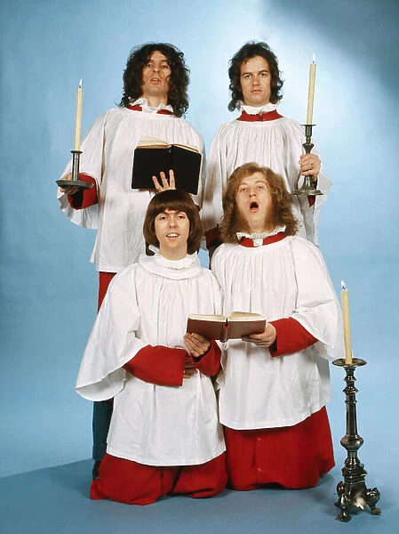 Slade at Christmas December 1974 Holding candles in candlesticks dressed as choir