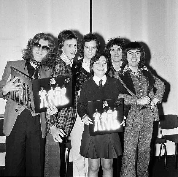 Slade (l-r Noddy Holder, Jim Lea, Don Powell and Dave Hill) pictured with prize winners