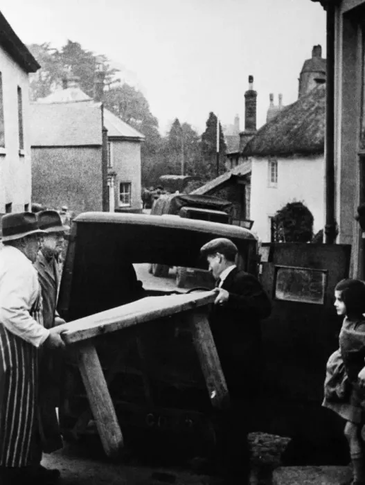 Framed Print : Slapton butcher moving the contents of his shop prior to completion of the evacuation of