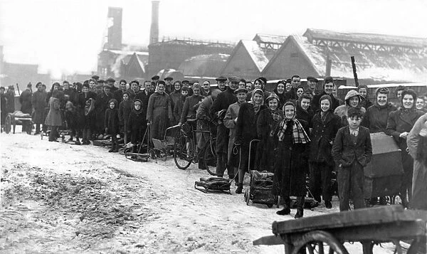 With sledges, prams and barrows a daily queue forms at the Redheugh Gasworks for coke