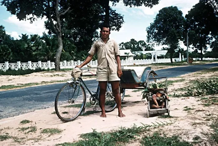 Framed Print : Sleeping child and bicycle rickshaw driver near Angkor Wat North West Kampuchea Cambodia Framed Print : Sleeping child and bicycle rickshaw driver near Angkor Wat North West Kampuchea Cambodia