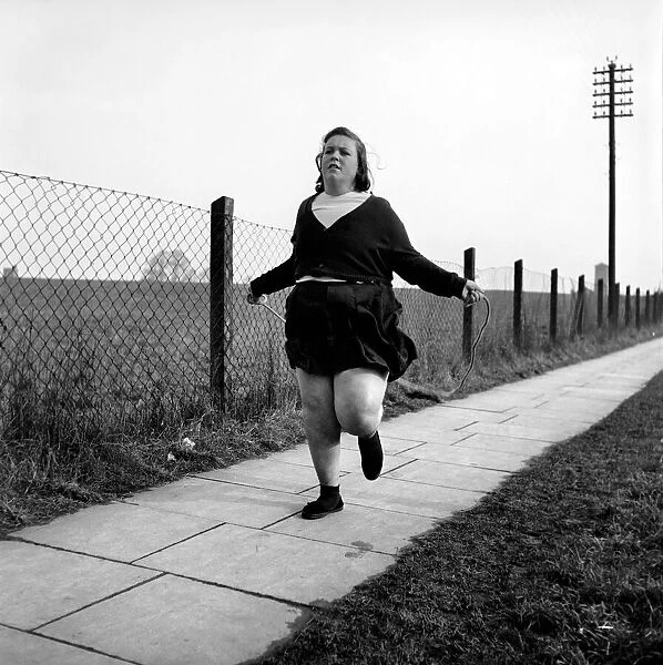 Slimming: Large woman skipping to get fit. A145