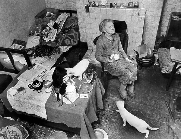 Slum housing in Birmingham. Mrs Alice Swanton aged 70 sits in her decaying terrace