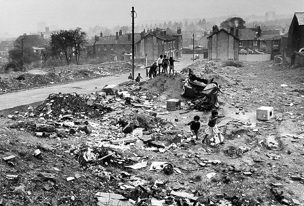 Slum housing in Birmingham. November 1967. Children play amongst the wreckage of
