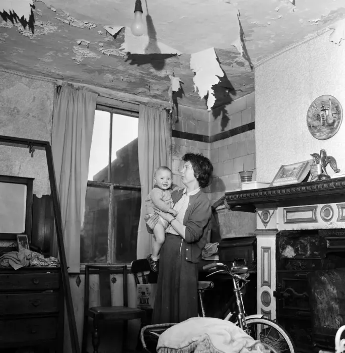 Framed Print : Slum housing in Salford. Mrs Moore and her 1 year old son Peter Framed Print : Slum housing in Salford. Mrs Moore and her 1 year old son Peter