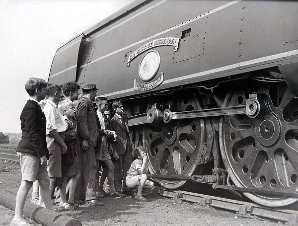 Small boys admire the Battle of Britain class steam locomotive during an open day at