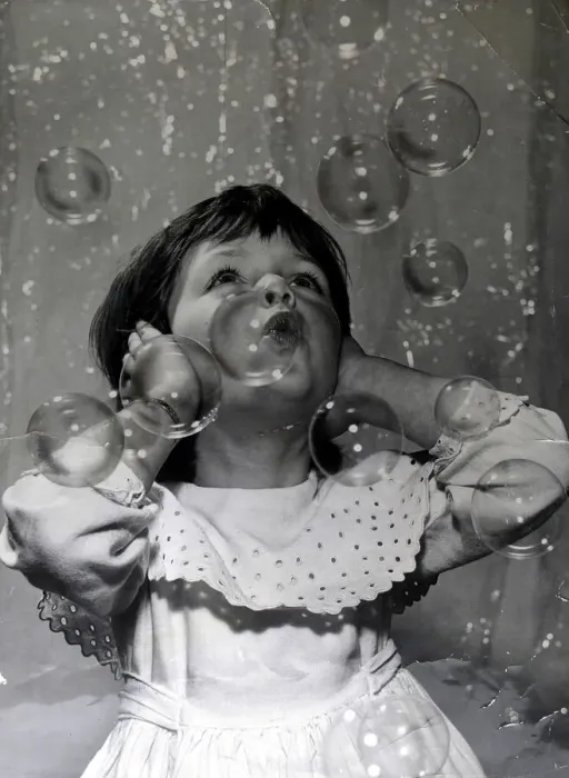 Framed Print : Small girl fascinated by the bubble machine at the 1959 Toy Fair This is a Framed Print : Small girl fascinated by the bubble machine at the 1959 Toy Fair This is a