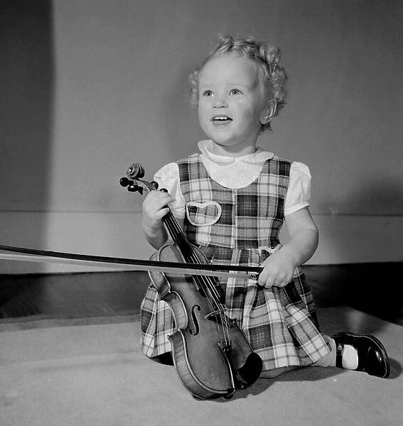 A small girl with her violin Circa 1957