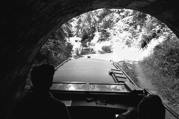 A small pleasure craft seen here emerging from the Chirk Tunnel on the Llangollen Canal
