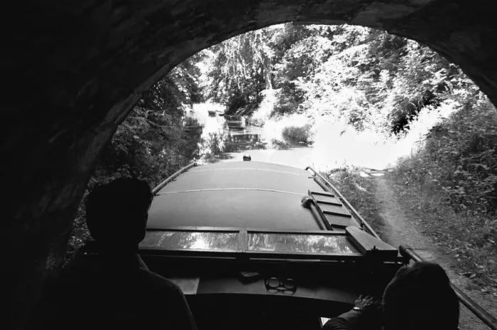 Framed Print : A small pleasure craft seen here emerging from the Chirk Tunnel on the Llangollen Canal