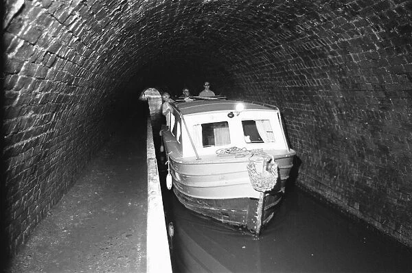 A small pleasure craft seen here passing through the Chirk Tunnel on the Llangollen Canal