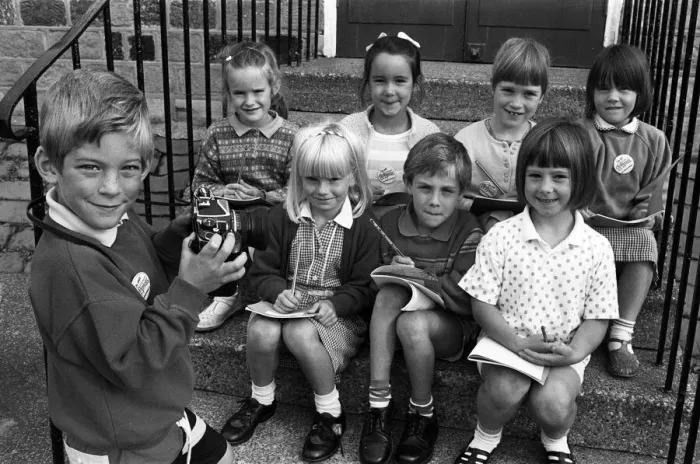 Framed Print : Smile please! Six-year-old Adam Bedford puts his reporter colleagues Framed Print : Smile please! Six-year-old Adam Bedford puts his reporter colleagues