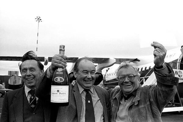 A smiling Sir Harry Secombe flew into Newcastle Airport