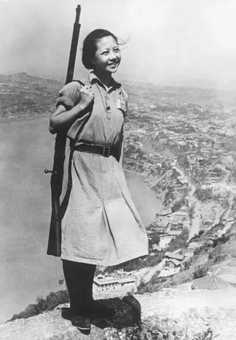 Framed Print : A smiling young girl, who is a soldier in the Chinese army during the Second World War
