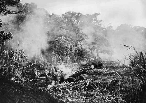 The smoke had barely cleared away when this picture of a US Marine 105 mm gun crew in