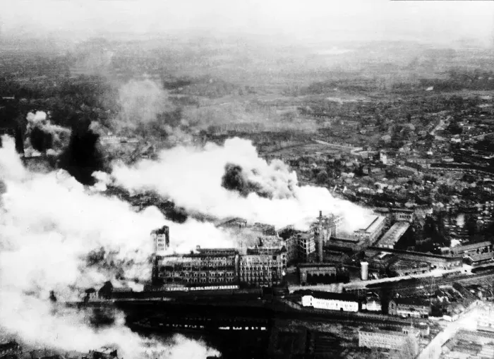 Framed Print : Smoke pours from The Philips radio valve works in Eidhoven Holland after a daylight raid Framed Print : Smoke pours from The Philips radio valve works in Eidhoven Holland after a daylight raid