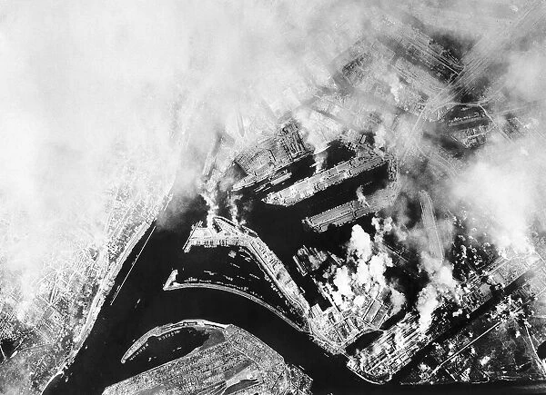 Smoke rises from the U Boats yards at Hamburg Germany after a daytime attack by B17