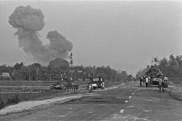 Smoke rising in the distance as armoured units of the South Vietnamese army shell Viet