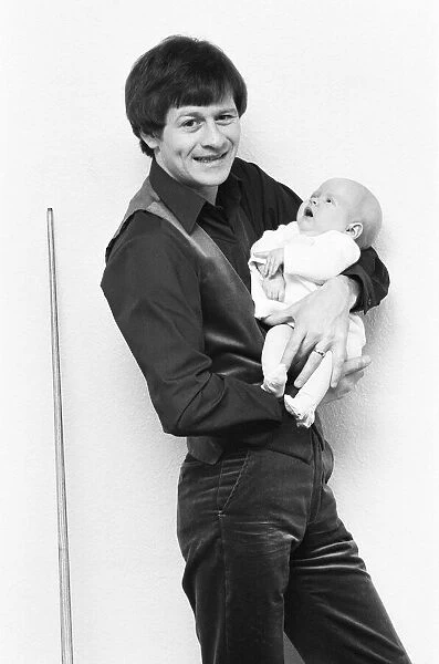 Snooker player Alex Hurricane Higgins with his baby daughter Lauren