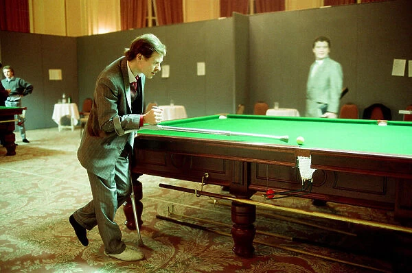 Snooker player Alex Hurricane Higgins with his foot in plaster