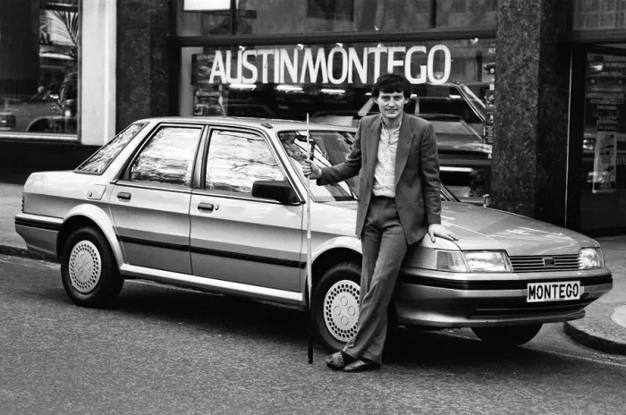 Framed Print : Snooker player Jimmy White poses beside a new model Austin Montego. 11th May 1984 Framed Print : Snooker player Jimmy White poses beside a new model Austin Montego. 11th May 1984