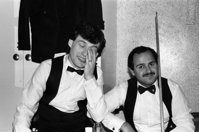 Framed Print : Snooker player Jimmy Whiteshares a joke with a fellow snooker player in the dressing room