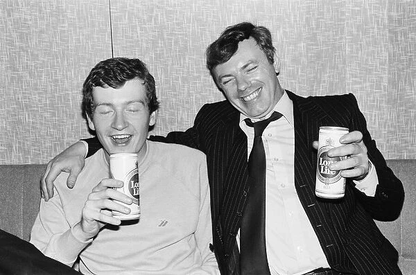 Snooker player Steve Davis having beer with a fan. 8th June 1981