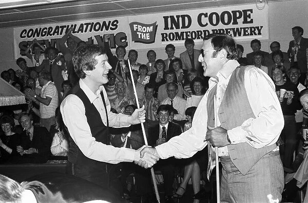 Snooker player Steve Davis with Mike Reid in Romford shaking hands after a game of