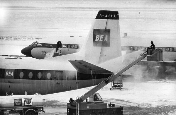 Snow Clearance at London Airport (Heathrow). BEA Aircraft being de-A Revolutionary