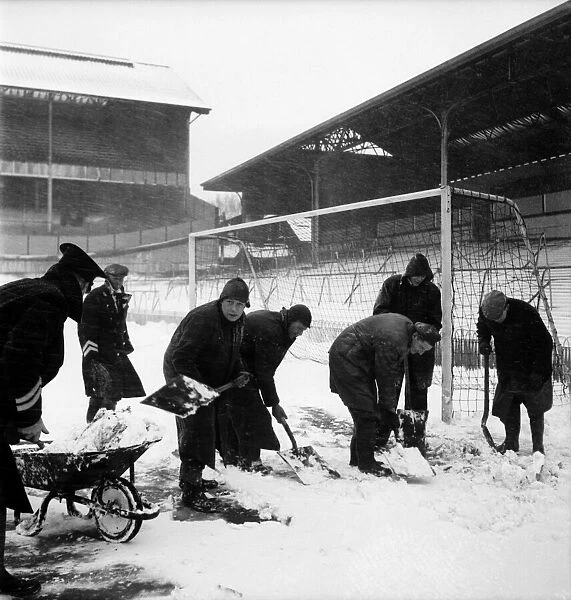 Snow Scene. Ground staff at White Hart Lane clearing the pitch for the FA Cup semi final