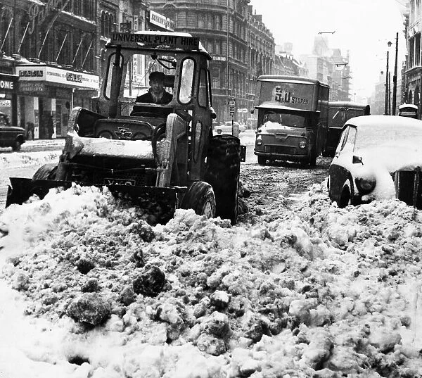 A snowplough busily clearing a path in St Marys Street