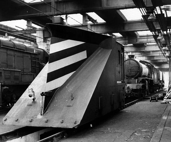 A snowplough waiting to be attached to an engine in the sheds on 9th September 1972