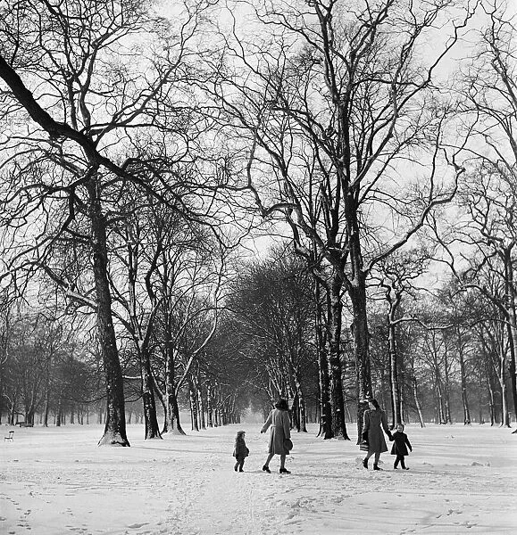 A snowy winter scene in Hyde Park, London. Circa 1953
