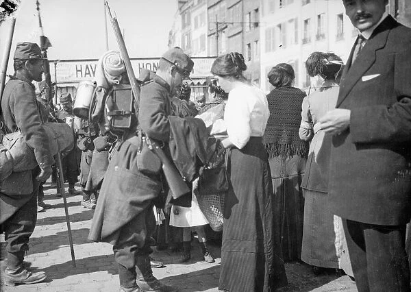 A soldier of the French 6th Army says goodbye to his wife at Le Harve before moving up to