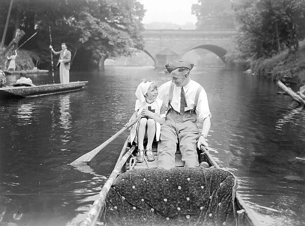 A soldier home from the front goes for a punt with his daughter down the river during