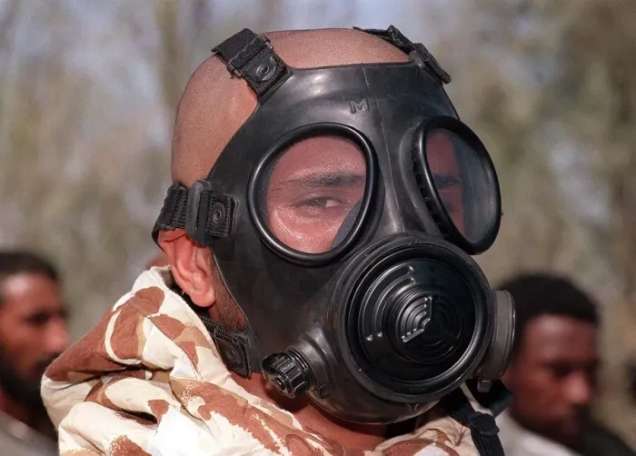 Framed Print : A soldier wears a gas mask in training Oct 1990 during the Gulf crisis